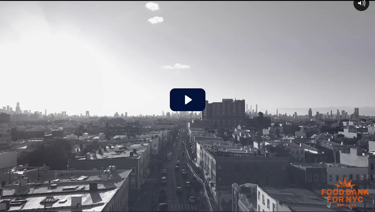 Aerial view of a bustling New York City street under a bright sky