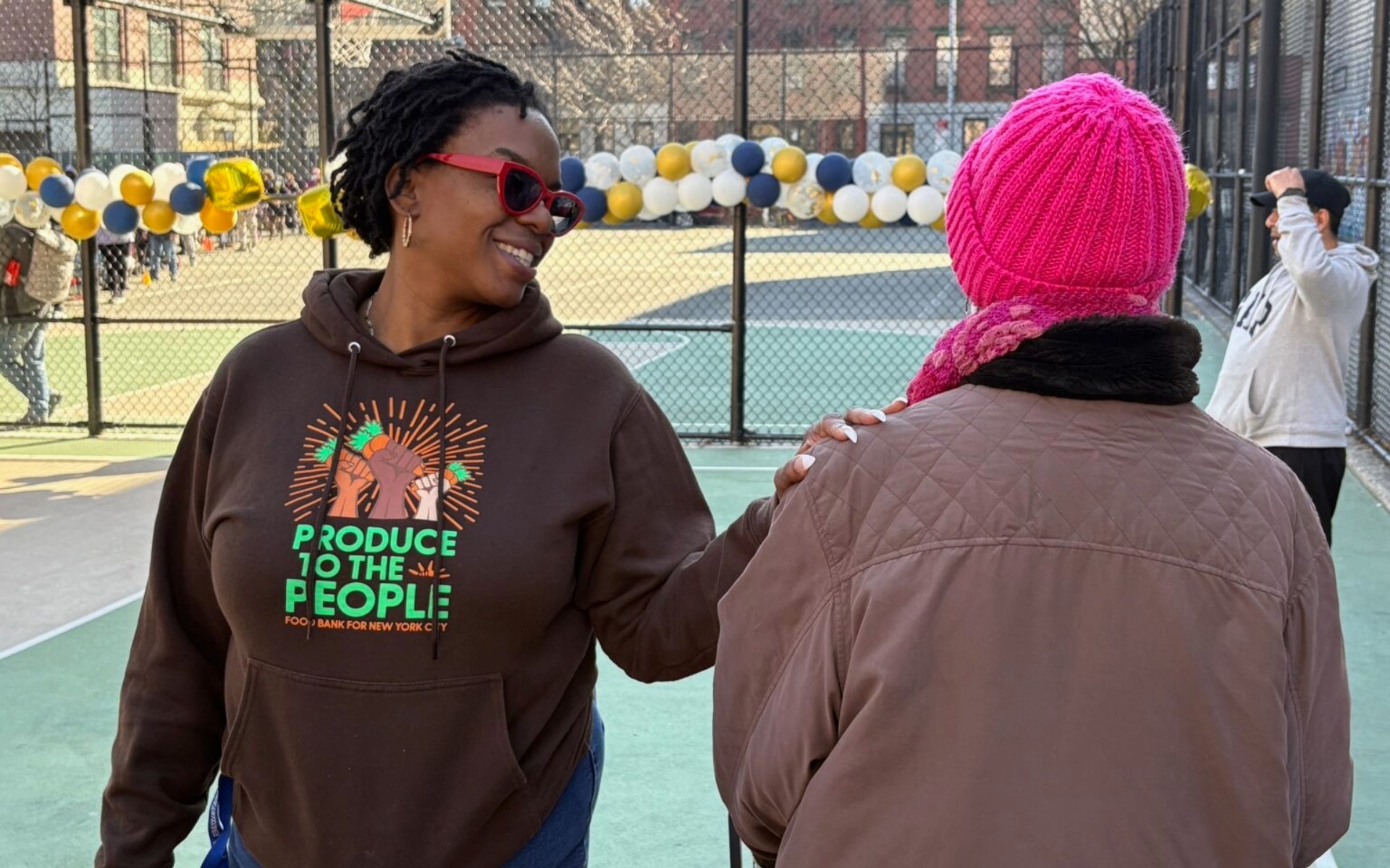 A Woman talking to a woman on a playground