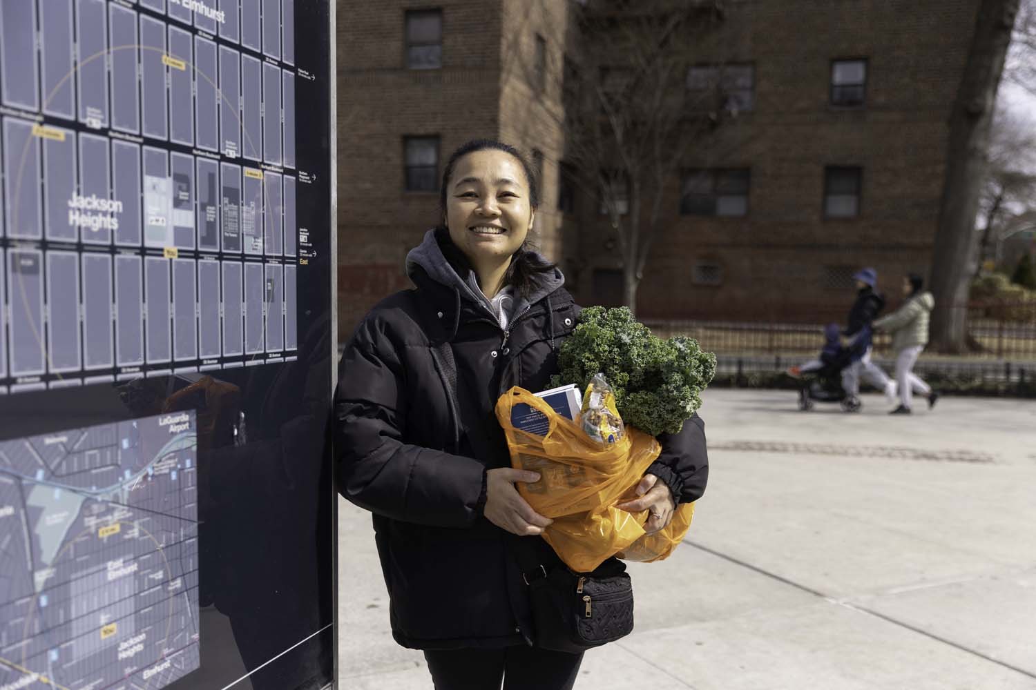 fbnyc-grateful-woman-holding-a-donated-grocery-bag-from-community-pantry Grateful woman holding a donated grocery bag from community pantry