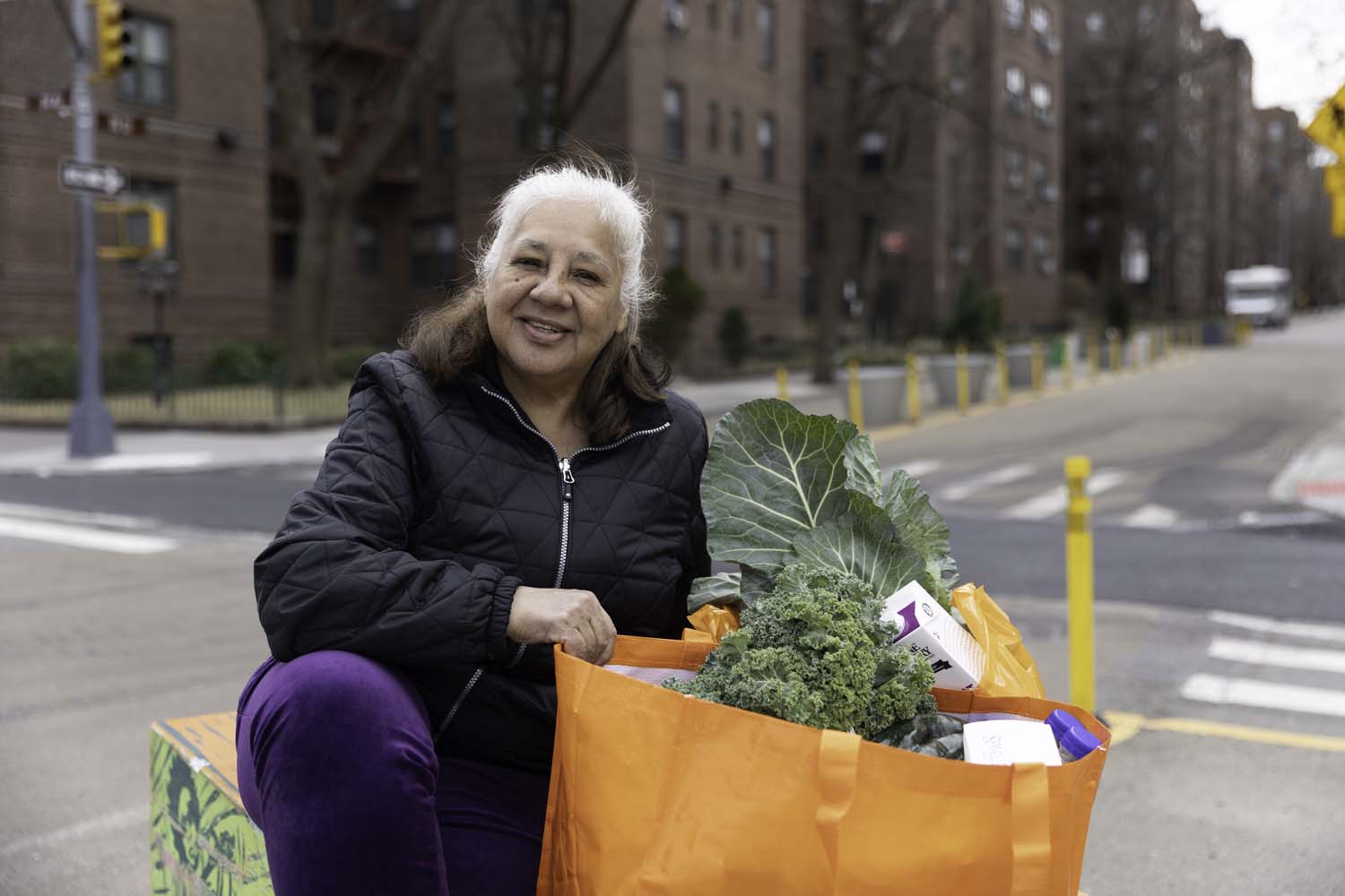 fbnyc-woman-holding-a-donated-grocery-bag-from-community-pantry Woman holding a donated grocery bag from community pantry