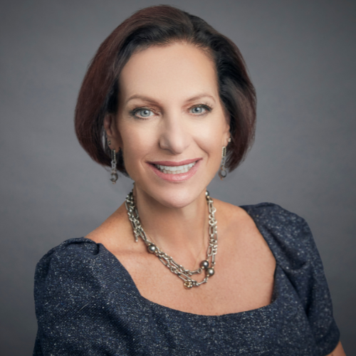 Andrea Shaw Resnick smiles for her headshot.