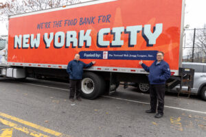 Larry and David Unger stand next to their Food Bank For NYC truck!