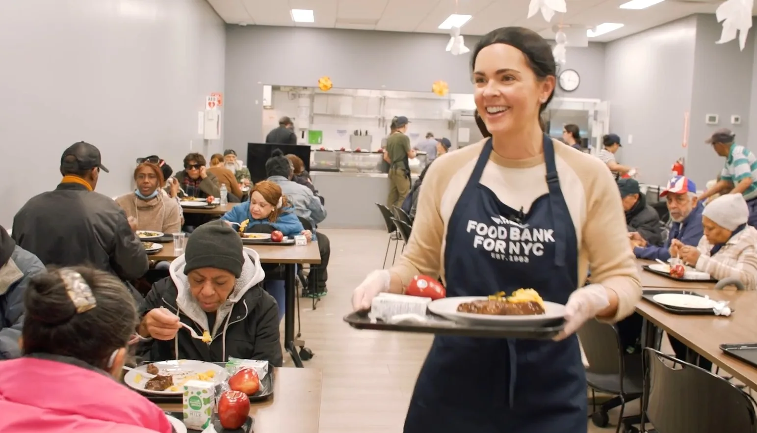 Katie Lee Biegel hands out meals at the Food Bank For NYC Community Kitchen.