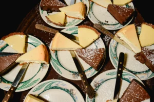 A table of plates topped with Peter Luger's homemade cakes.